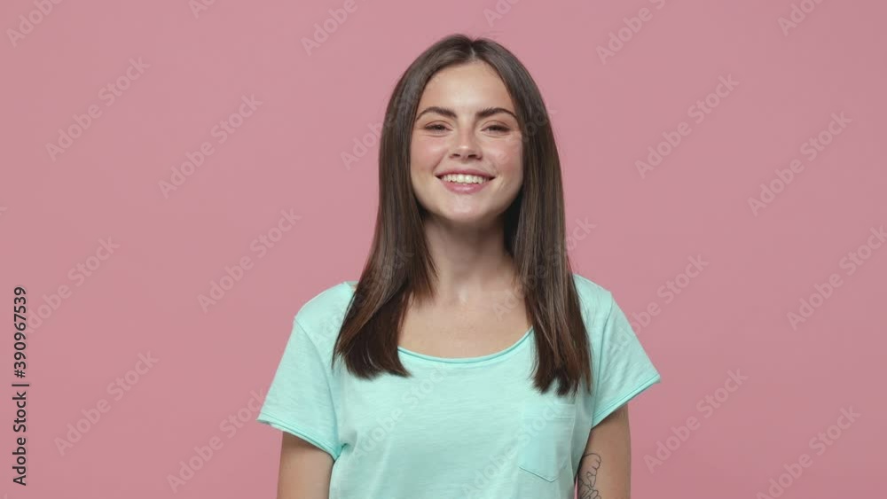 Smiling pensive pretty young brunette woman 20s years old wearing casual blue t-shirt posing isolated on pink colour background in studio. People sincere emotions lifestyle concept. Looking aside up Smiling pensive pretty young brunette woman 20s years old wearing casual blue t-shirt posing isolated on pink colour background in studio. People sincere emotions lifestyle concept. Looking aside up