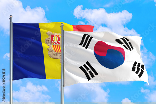 South Korea and Andorra national flag waving in the windy deep blue sky. Diplomacy and international relations concept.