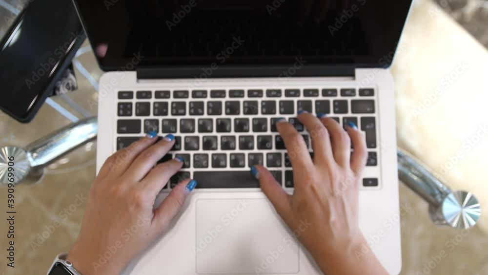 Woman working with laptop on Desktop. Woman Blogger Freelancer Working on Laptop at Cafe. slow motion. Top of view Woman working with laptop on Desktop. Woman Blogger Freelancer Working on Laptop at Cafe. slow motion. Top of view