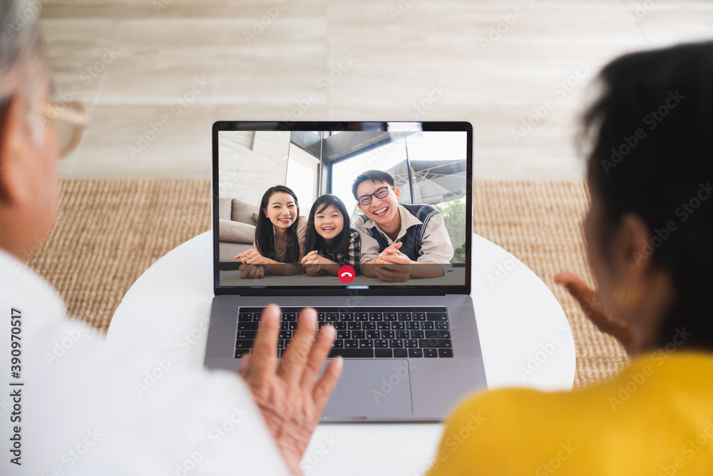 Asian old senior couple video call virtual meeting via computer laptop with family Asian old senior couple video call virtual meeting via computer laptop with family