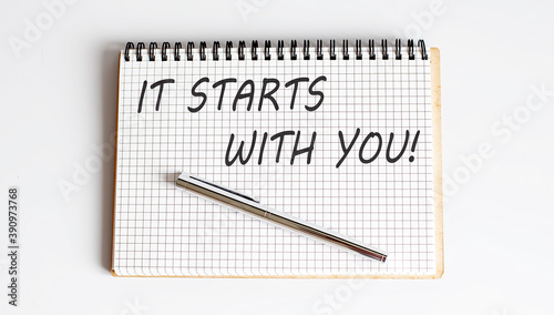 Wallpaper Mural Notebook with pen and Notes about It Starts With You Torontodigital.ca