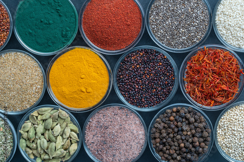 Assortment colorful spices, seeds and herbs for cooking food, top view