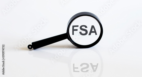 Magnifier with text FSA on the white background