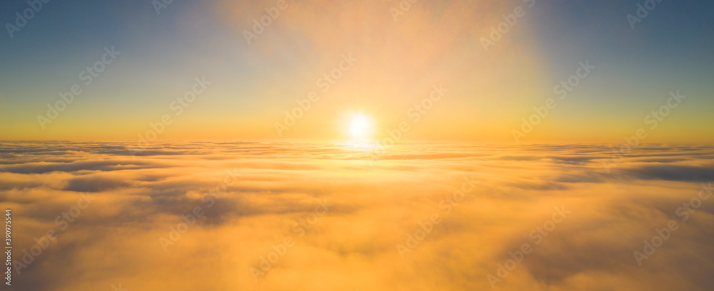 Morning Rising Sun in haze over fog - panorama made by a high-flying drone