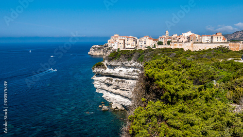 Fototapeta Naklejka Na Ścianę i Meble -  Corsica Bonifacio white cliff with citadel old town facing the Mediterranean Sea during sunny day