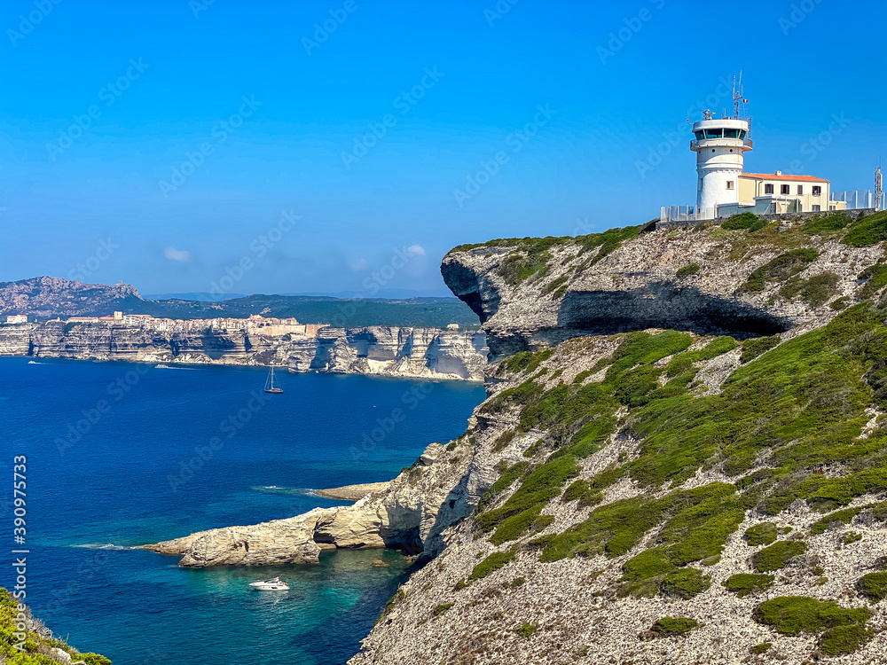 Corsica Bonifacio white cliff with citadel old town facing the Mediterranean Sea during sunny day
