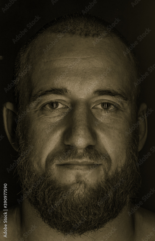 Fototapeta premium Studio session with one muscular man in low-key light conditions