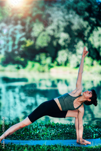 Yoga Woman by The Water. Extended Triangle Pose