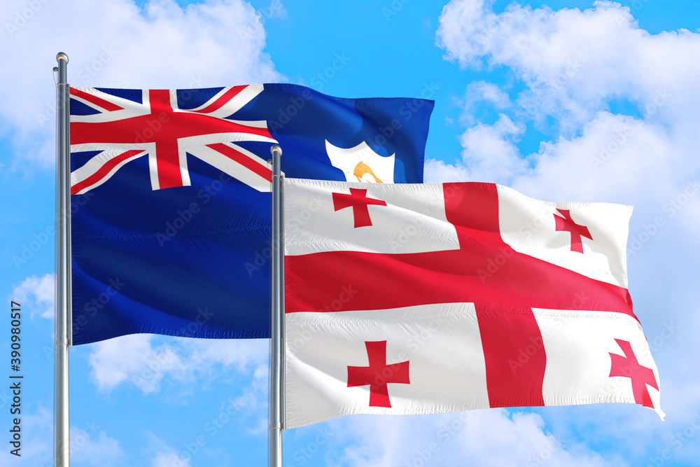 Georgia and Anguilla national flag waving in the windy deep blue sky. Diplomacy and international relations concept.