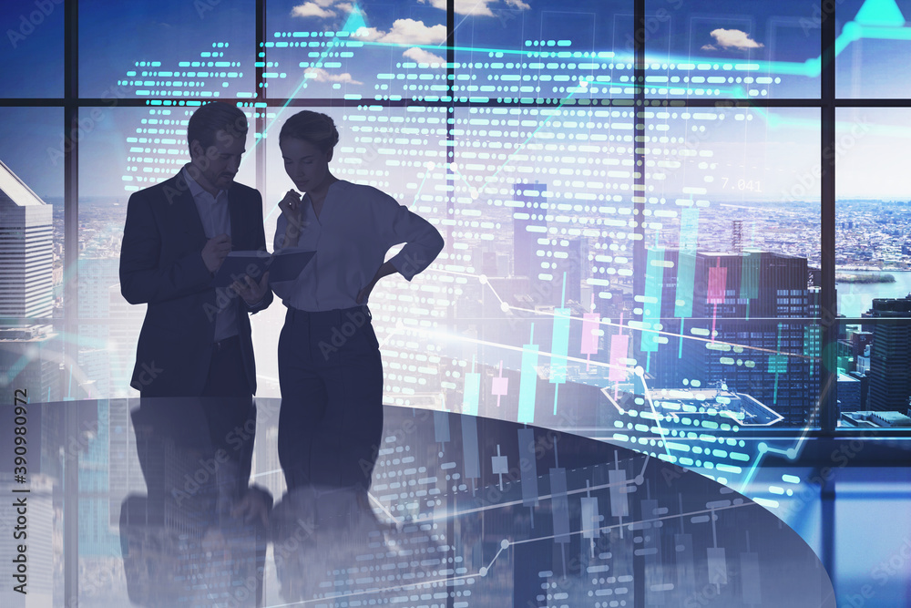 Fototapeta premium Man and woman in panoramic office, financial graph