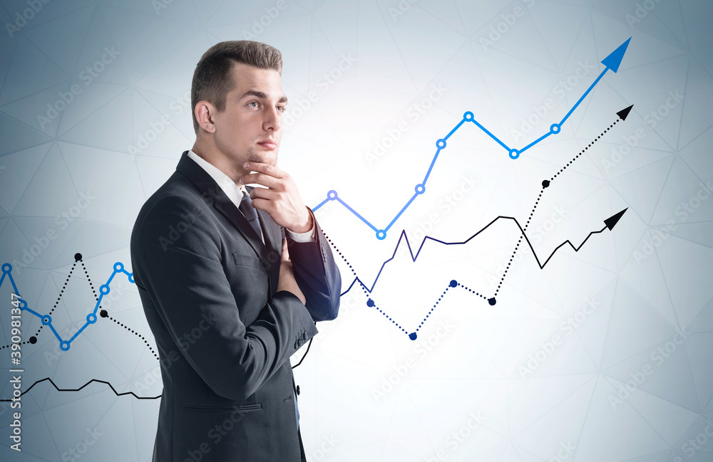 Pensive businessman and growing graph