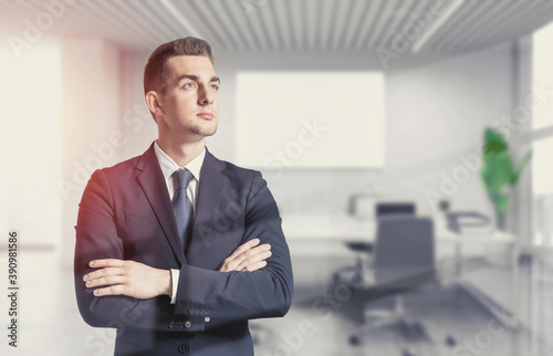 Confident young businessman in office