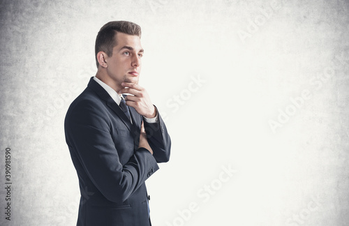 Thoughtful young businessman, side view mock up