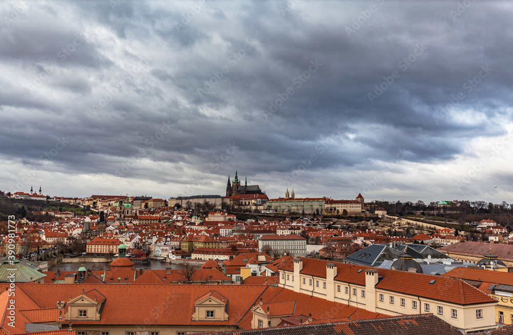 Aerial panorama view of Prague cityscape with historic buildings and Vltava river flowing through the old town on a cloudy day from top of Clementinum, Prague Czech Republic