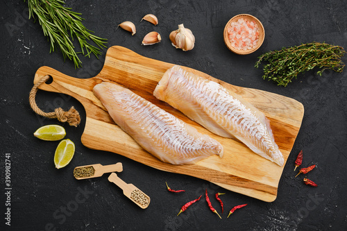Top view of haddock fillet with seasoning photo