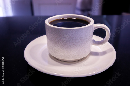 White Coffee Cup with Americano black coffee on black