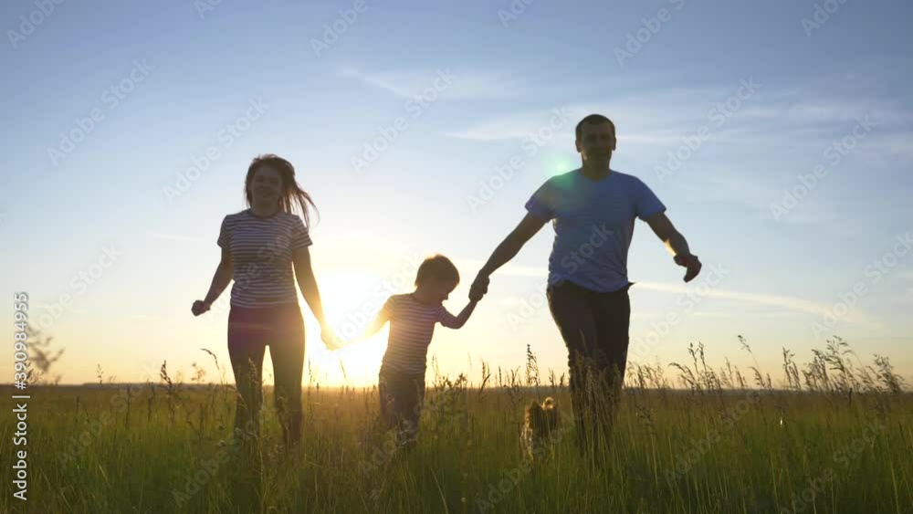 Happy family in the park. Teamwork. Group of people run at sunset. Silhouette happy family at sunset in the park. Teamwork, running. Happy child. Silhouette family in the park playing airplane pilot Happy family in the park. Teamwork. Group of people run at sunset. Silhouette happy family at sunset in the park. Teamwork, running. Happy child. Silhouette family in the park playing airplane pilot
