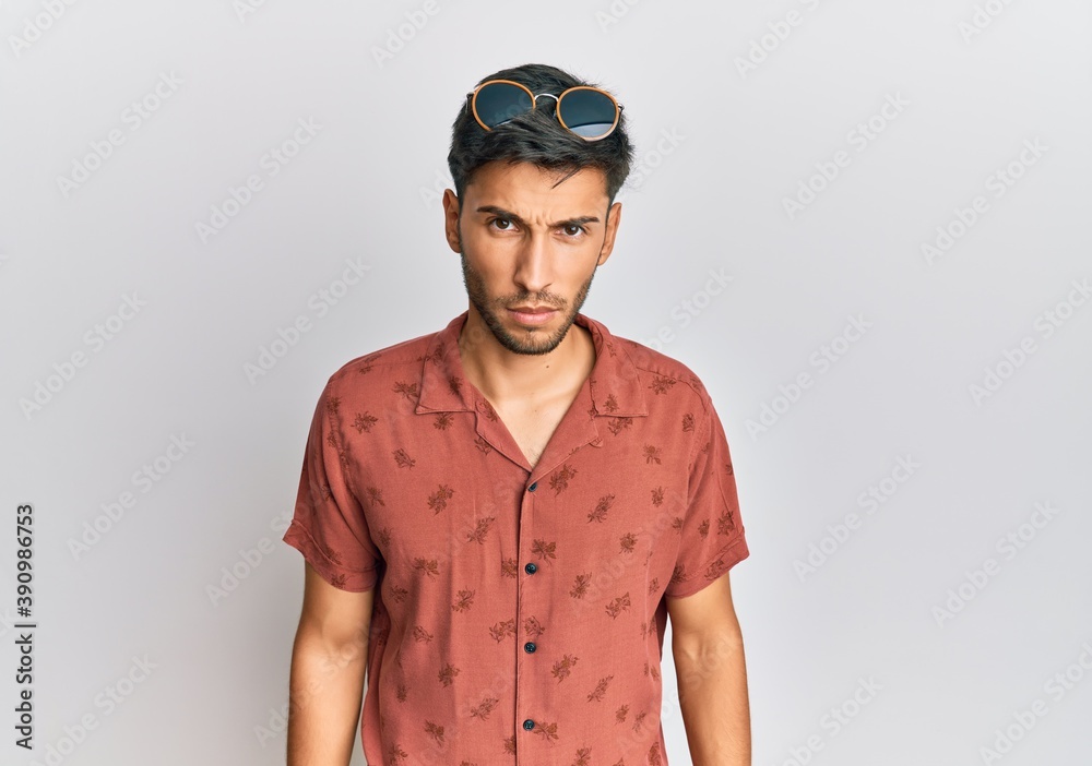 Young handsome man wearing casual summer clothes skeptic and nervous, frowning upset because of problem. negative person.