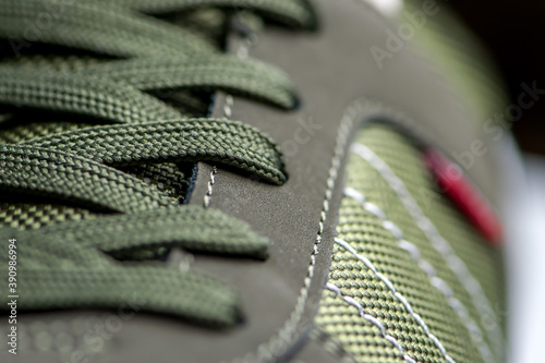 fashionable Stylish sneaker close-up texture of sports shoes knotted laces on gumshoes