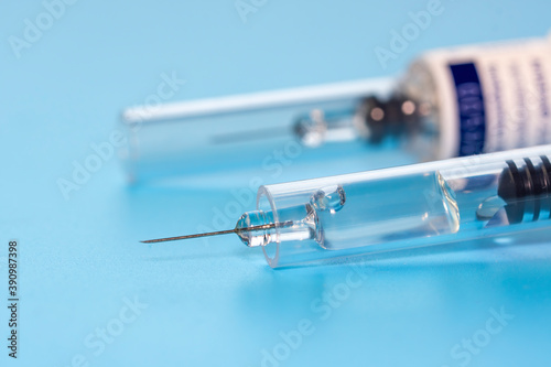 Macro photography of an pre-filled syringe with an automatic safety system. photo