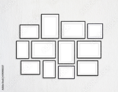 Black frames collection, twelve blank frameworks set on white textured wall, interior decor mock up