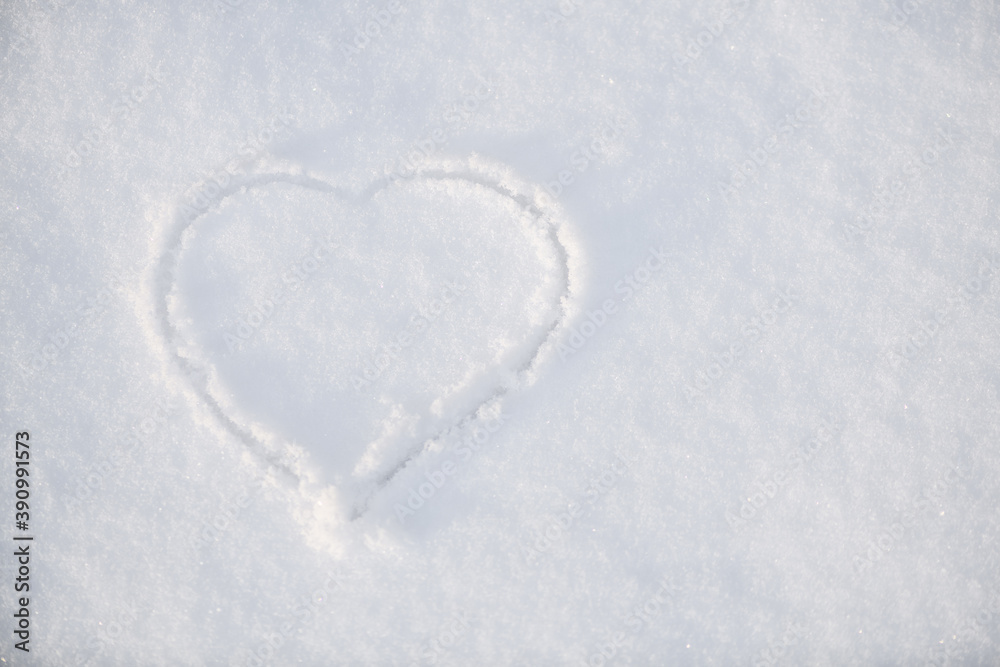 One heart in the snow. A heart is drawn on the snow close-up. The shape of heart on the snow. Winter background.. One heart in the snow. A heart is drawn on the snow close-up. The shape of heart on the snow. Winter background..