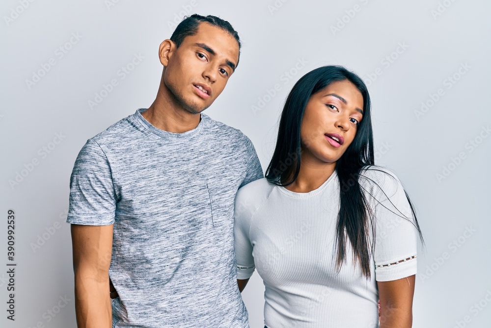 Young latin couple wearing casual clothes looking sleepy and tired, exhausted for fatigue and hangover, lazy eyes in the morning. Young latin couple wearing casual clothes looking sleepy and tired, exhausted for fatigue and hangover, lazy eyes in the morning.