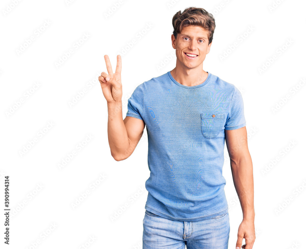 Young handsome man wearing casual clothes showing and pointing up with fingers number two while smiling confident and happy. Young handsome man wearing casual clothes showing and pointing up with fingers number two while smiling confident and happy.