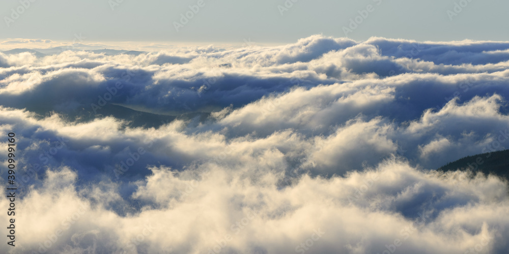 Majestic view of the clouds in the mountains