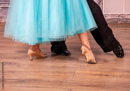 beautiful female dancer legs in golden dance shoes