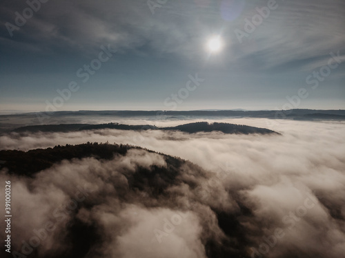 Aerial view of morning foggy landscape. Fall autumn peaceful scenery. Misty calm atmosphere. Drone photo of Czech mountains. Trees in fog. Fairy tale land.Meditation dreamy concept © Eva