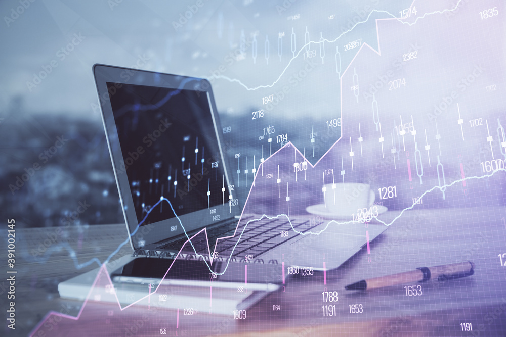 Stock market chart hologram drawn on personal computer background. Double exposure. Concept of investment. Stock market chart hologram drawn on personal computer background. Double exposure. Concept of investment.