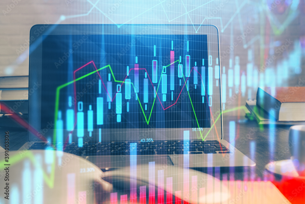 Stock market graph and table with computer background. Multi exposure. Concept of financial analysis.