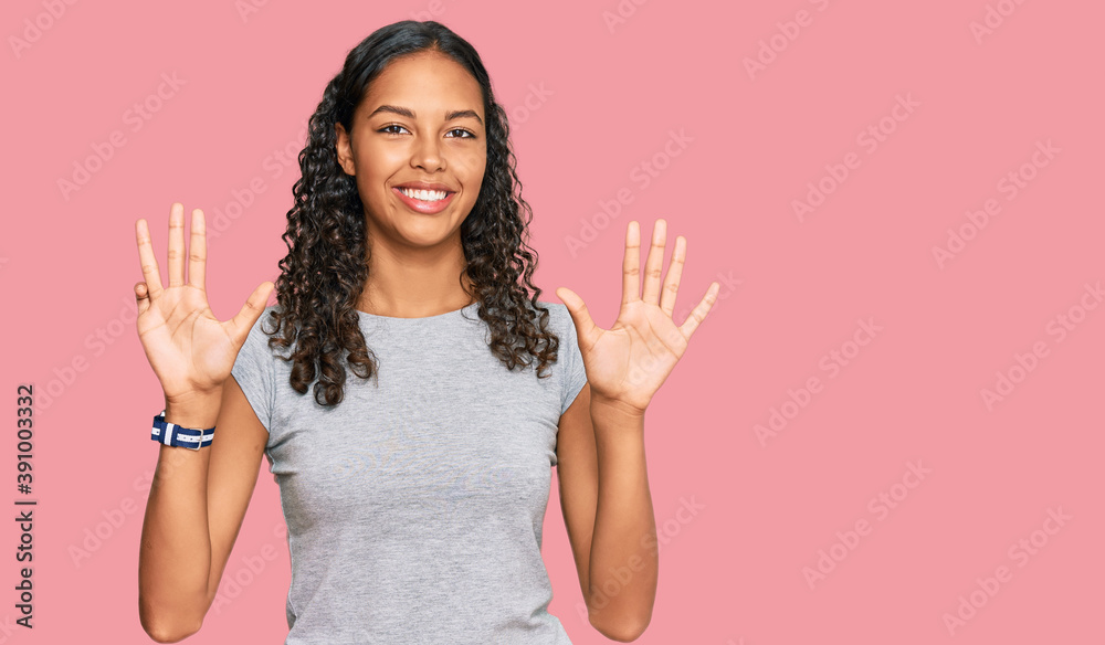 Young african american girl wearing casual clothes showing and pointing up with fingers number nine while smiling confident and happy. Young african american girl wearing casual clothes showing and pointing up with fingers number nine while smiling confident and happy.