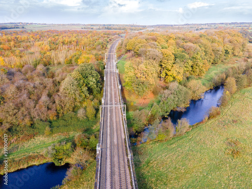 Dutton Viaduct is a railway viaduct on the West Coast Main Line where it crosses the River Weaver and the Weaver Navigation between the villages of Dutton and Acton Bridge in Cheshire, England photo