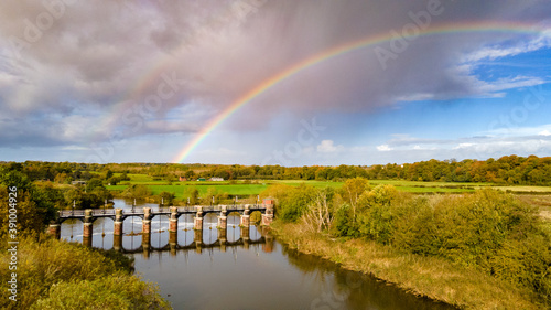 Dutton sluice, on the River Weaver near Dutton Locks with Rainbow and surrounding countryside