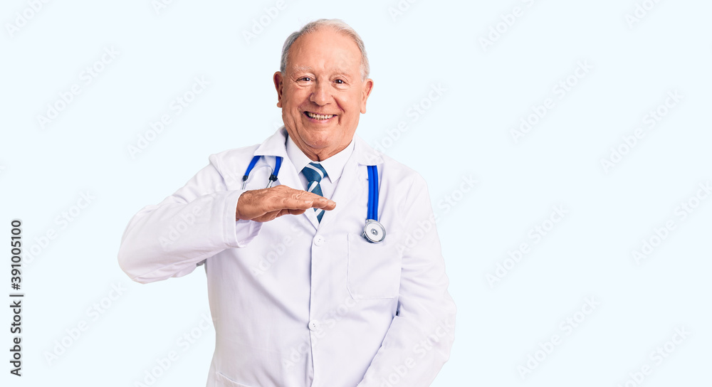 Senior handsome grey-haired man wearing doctor coat and stethoscope gesturing with hands showing big and large size sign, measure symbol. smiling looking at the camera. measuring concept. Senior handsome grey-haired man wearing doctor coat and stethoscope gesturing with hands showing big and large size sign, measure symbol. smiling looking at the camera. measuring concept.