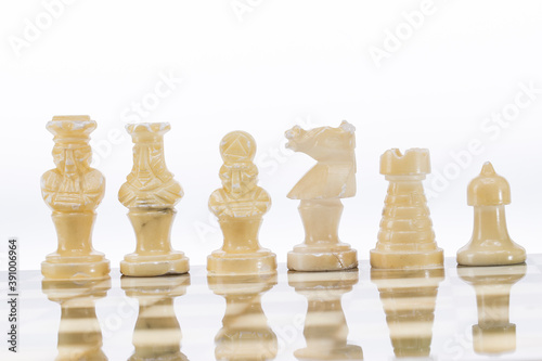 Сhess as an abstract concept. Beautiful antique chess set on marble chess board.