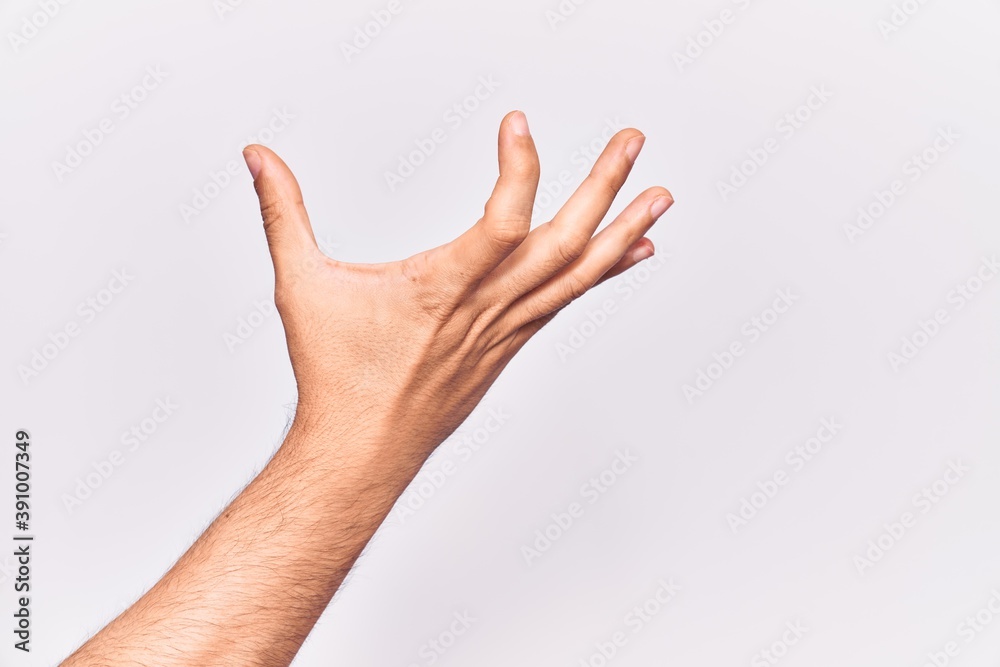 Close up of hand of young caucasian man over isolated background picking and taking invisible thing, holding object with fingers showing space Close up of hand of young caucasian man over isolated background picking and taking invisible thing, holding object with fingers showing space