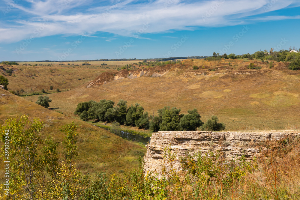 View of the cliffs near the Vorgol river and the surrounding landscape. Tourist and rock climbing place near the city of Yelets, Lipetsk region, Russia