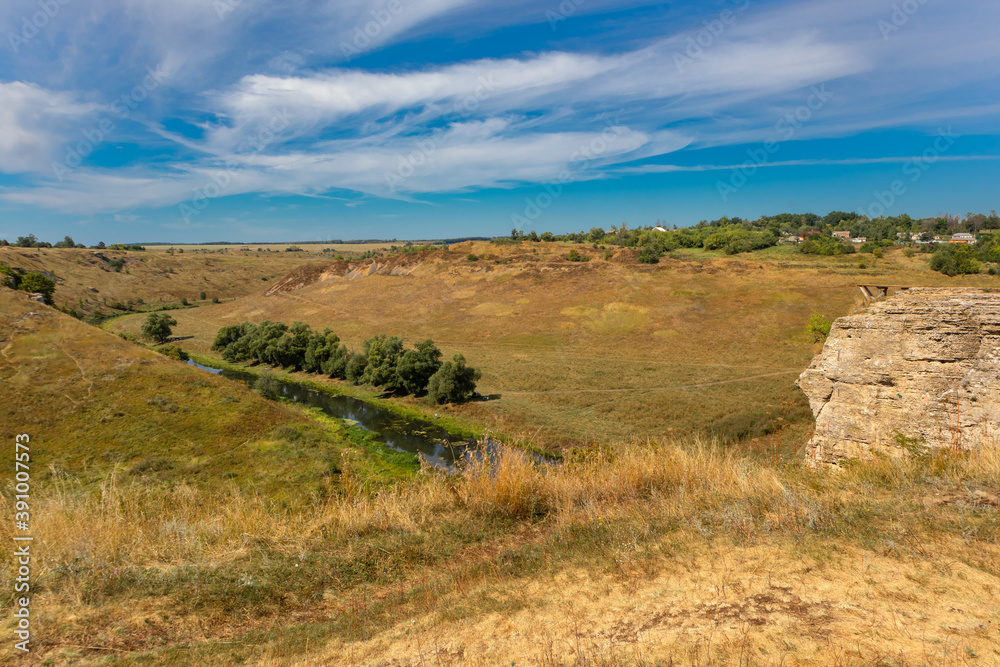 View of the cliffs near the river Vorgol and the surrounding landscape. Tourist and rock climbing place near the city of Yelets, Lipetsk region, Russia