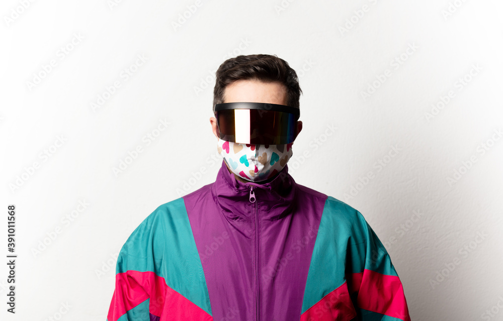 Style man in tracksuit and futuristic glasses on white background