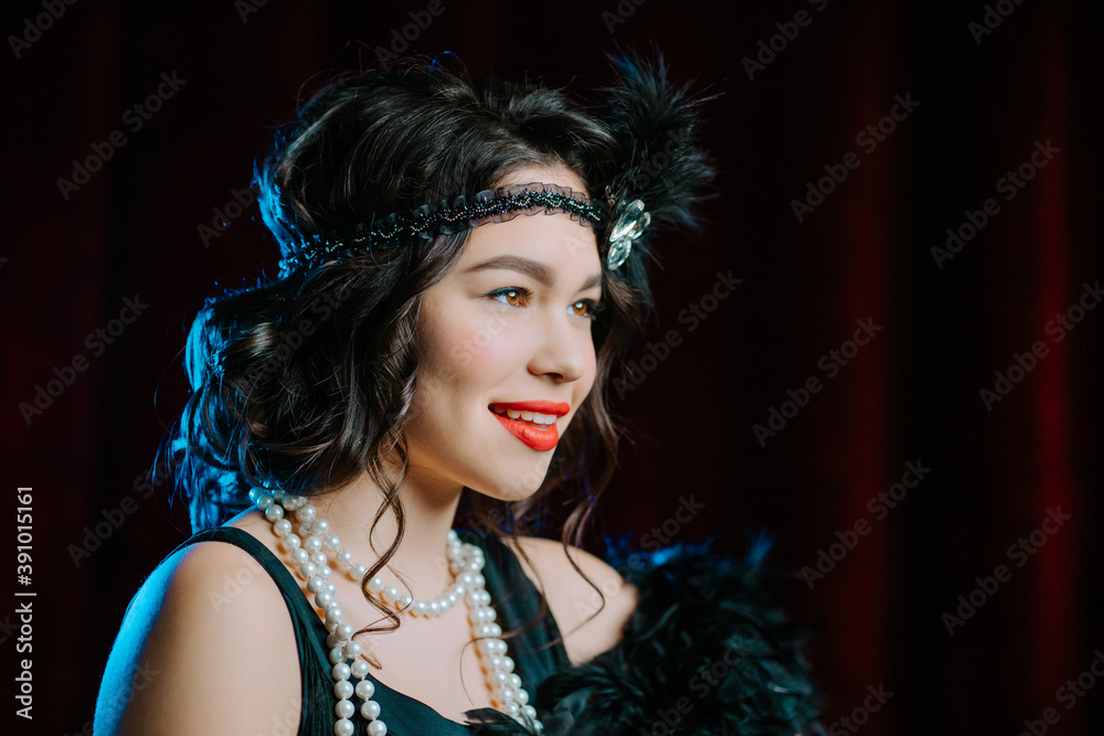 Fototapeta premium Amazing portrait of brunette woman dressed in style of 20th last century on velours background. Roaring twenties, retro, party, fashion concept