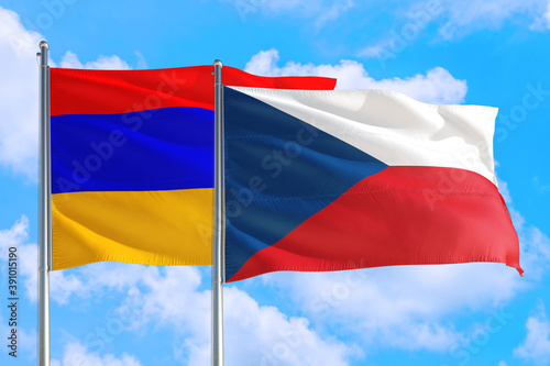 Czech Republic and Armenia national flag waving in the windy deep blue sky. Diplomacy and international relations concept.