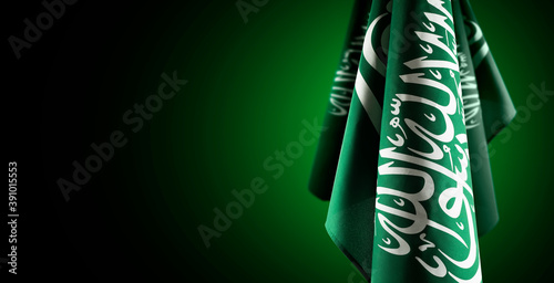 Saudi Arabia flags with a light from behind, use it for national day and country national occasions. photo