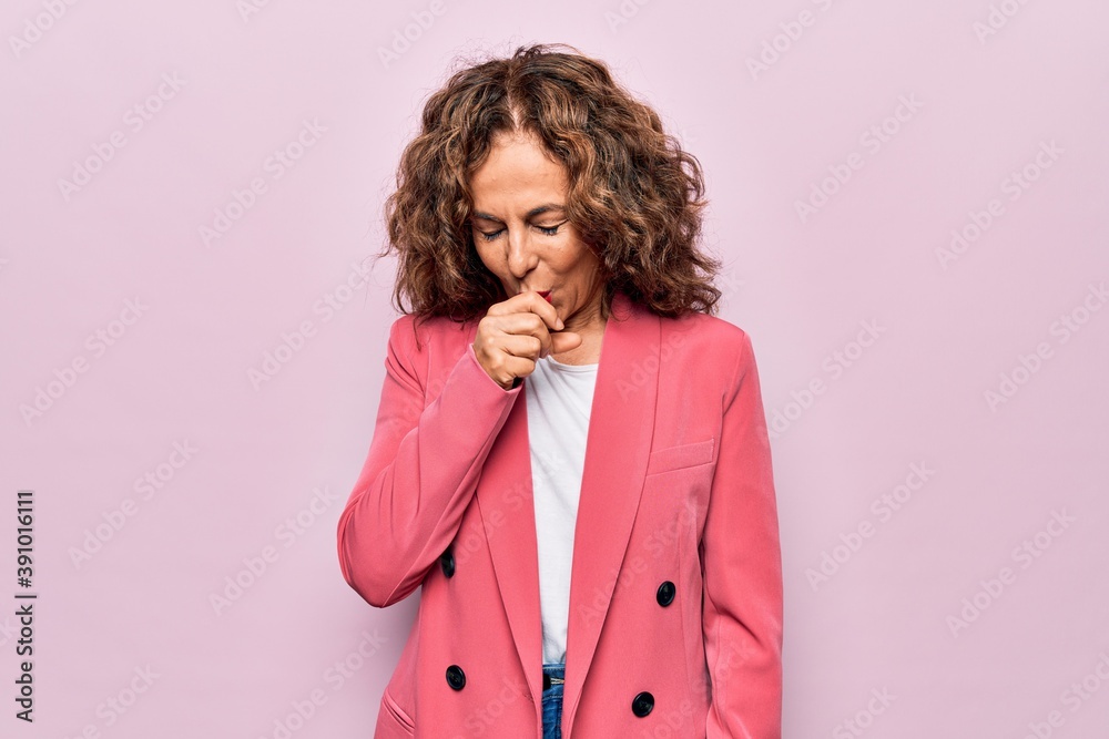 Middle age beautiful businesswoman wearing jacket standing over isolated pink background feeling unwell and coughing as symptom for cold or bronchitis. Health care concept. Middle age beautiful businesswoman wearing jacket standing over isolated pink background feeling unwell and coughing as symptom for cold or bronchitis. Health care concept.