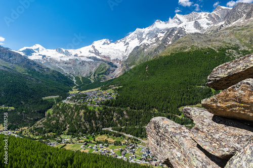 Huge coloured rocks in the foreground with Alphubel, Täschhorn, Dom, Lenzspitze, Nadelhorn, Stecknadelhorn, Hohberghorn mountain peaks in the background above glaciers, Says-Fee and Saas-Grund resorts