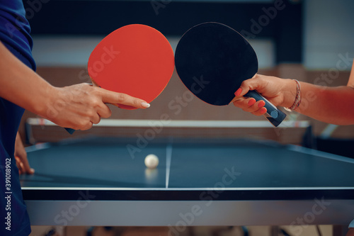 Women holds ping pong rackets, table tennis photo