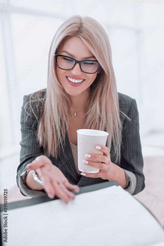 young businesswoman discussing working papers during coffee break young businesswoman discussing working papers during coffee break