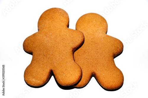 Two gingerbread men on a white background
